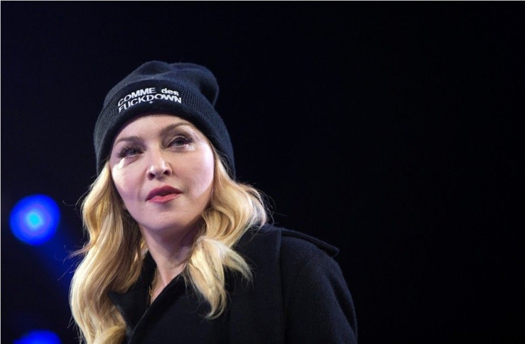 Singer Madonna walks on stage during Amnesty International's &quot;Bringing Human Rights Home&quot; concert