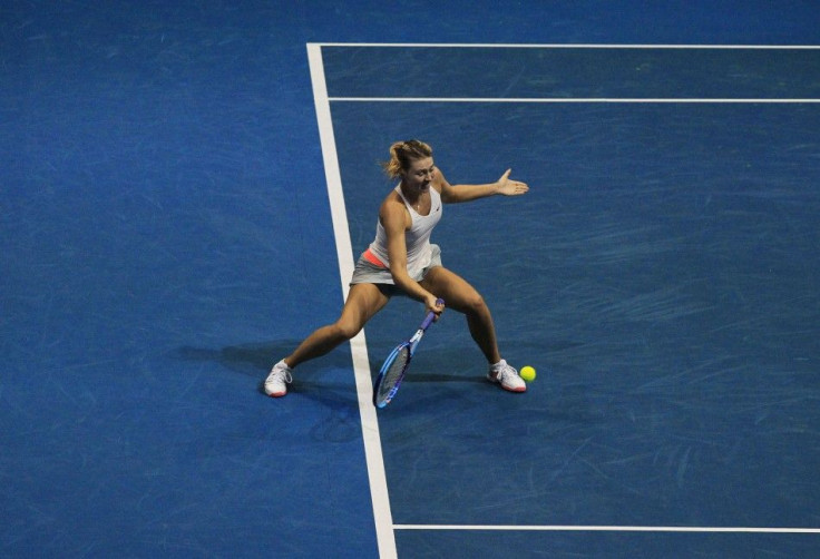 Maria Sharapova of the Manila Mavericks team hits the ball during the women's single match against Ana Ivanovic of the Indian Aces at the International Premier Tennis League in Manila November 29, 2014. Ivanovic won over Sharapova. REUTERS/Romeo Rano