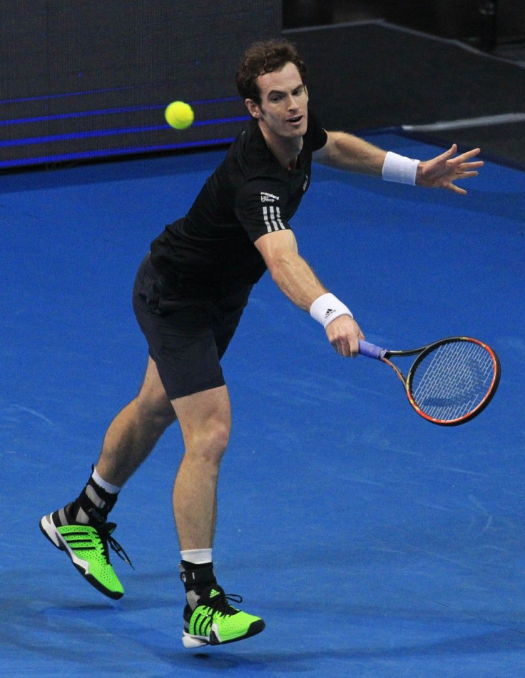 Andy Murray of the Manila Maverics return a shot to Nick Kyrgios of the Singapore Slammers during their men's single match at the International Premier Tennis League (IPTL) in Manila November 30, 2014. REUTERS/Romeo Ranoco