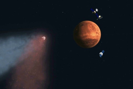An undated artist&#039;s concept of Comet Siding Spring approaching Mars, shown with NASA&#039;s orbiters preparing to make science observations of this unique encounter, is seen in a NASA handout.
