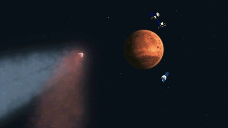 An undated artist&#039;s concept of Comet Siding Spring approaching Mars, shown with NASA&#039;s orbiters preparing to make science observations of this unique encounter, is seen in a NASA handout.