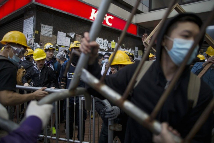 Pro-democracy Protesters Move Barricade Reinforcements Up Onto An Escalator Near The Government Headquarters In Hong Kong's Admiralty District