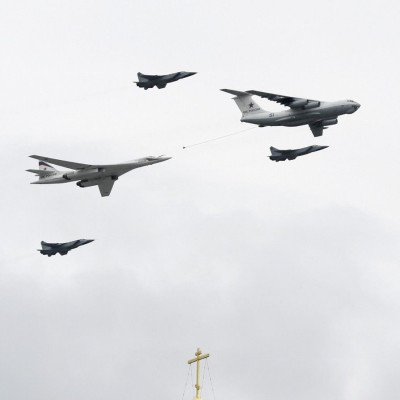 A Tupolev Tu-160 bomber, an Ilyushin Il-78 refueling tanker and three MiG-31 fighter jets fly in formation over Red Square and the Kremlin during a military parade dress rehearsal in Moscow May 6, 2010.