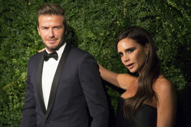 Former British Soccer Player David Beckham And His wife, Fashion Designer Victoria Beckham During The Evening Standard Theatre Awards In London