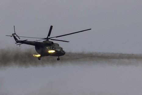 A Serbian Mi-8 helicopter gunship fires unguided rockets on targets during a training exercise in the village of Nikinci, west from Belgrade, November 14, 2014. 