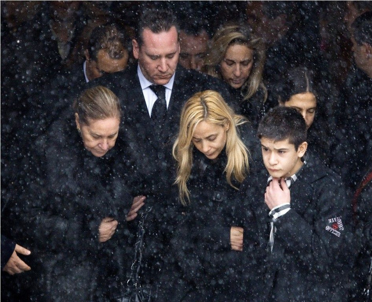 The family of Nick Rizzuto leaves the church following his funeral in Montreal