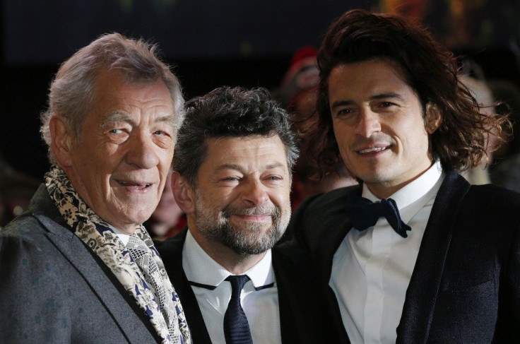Cast members Ian McKellen (L) and Orlando Bloom pose for photographers with second unit director Andy Serkis (C) as they arrive for the world film premiere of "The Hobbit: The Battle of the Five Armies" at Leicester Square in central London, Dec