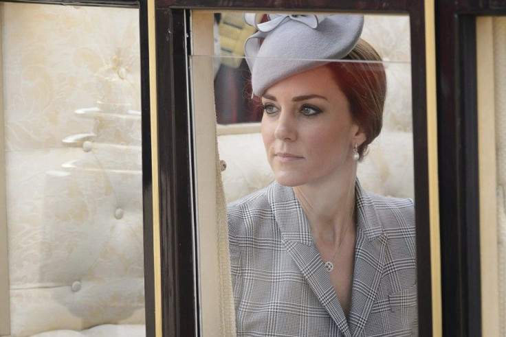 Britain&#039;s Catherine, Duchess of Cambridge takes her seat in a State Carriage for the carriage procession to Buckingham Palace, as part of the ceremonial welcome ceremony for Singapore&#039;s President Tony Tan at the start of a state visit at Horse G