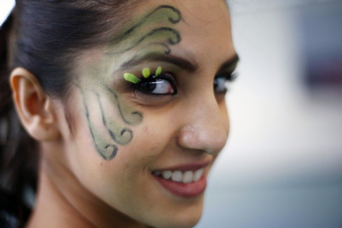 Miss India Koyal Rana wears face paint during the Miss World sports competition at the Lee Valley sports complex in north London
