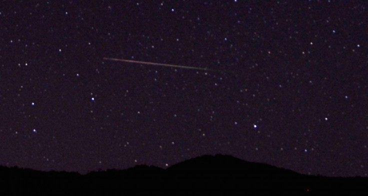 A meteor streaks over the northern skies in the early morning during the Perseid meteor shower north of Castaic Lake, California August 12, 2013. According to NASA, the Perseid meteor shower, which is an annual event, reaches its peak on August 11 and 12.