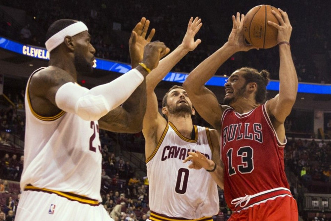 Kevin Love and LeBron James tries to stop Joakim Noah