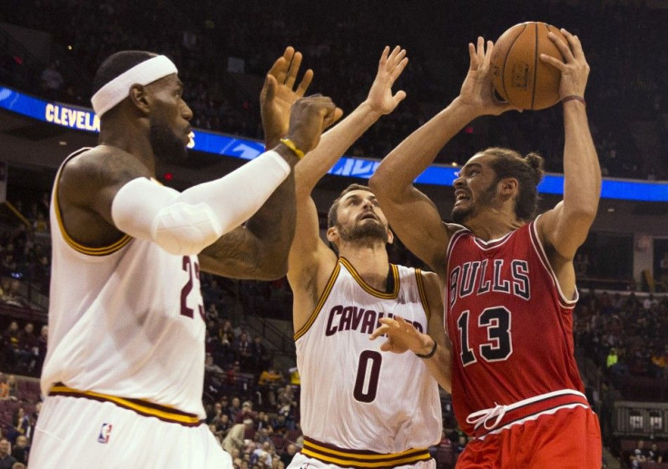 Kevin Love and LeBron James tries to stop Joakim Noah