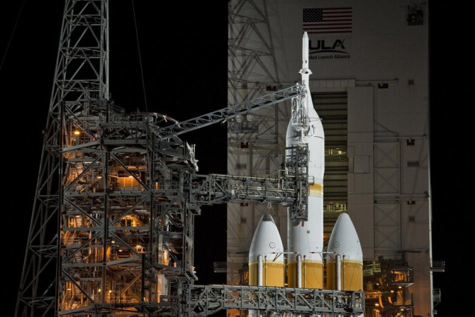 The Mobile Service Tower rolls back from the Delta IV Heavy with the Orion spacecraft on launch pad 37B