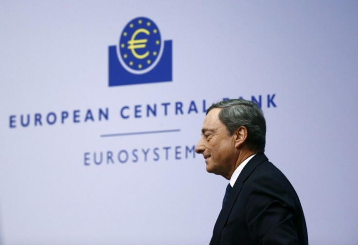 European Central Bank (ECB) President Mario Draghi leaves after addressing an ECB news conference December 4, 2014, for the first time in the ECB's new 1.3 billion euro headquarters in Frankfurt. Draghi said on Thursday the bank would reassess the impact 