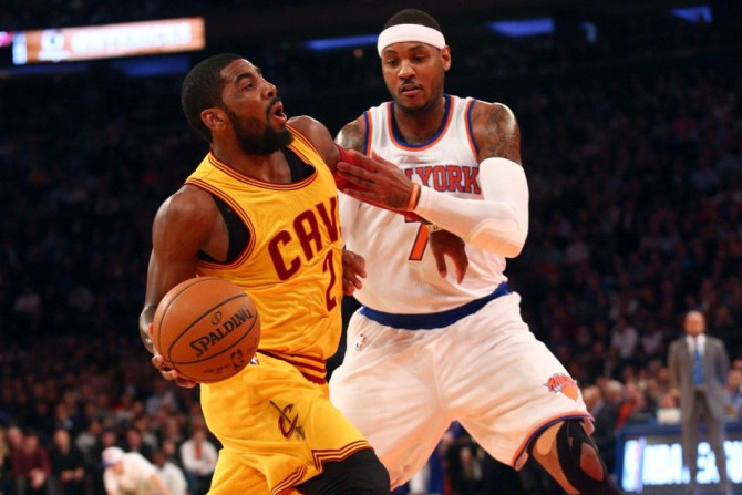 Dec 4, 2014; New York, NY, USA; Cleveland Cavaliers point guard Kyrie Irving (2) is fouled by New York Knicks small forward Carmelo Anthony (7) during the first quarter at Madison Square Garden.