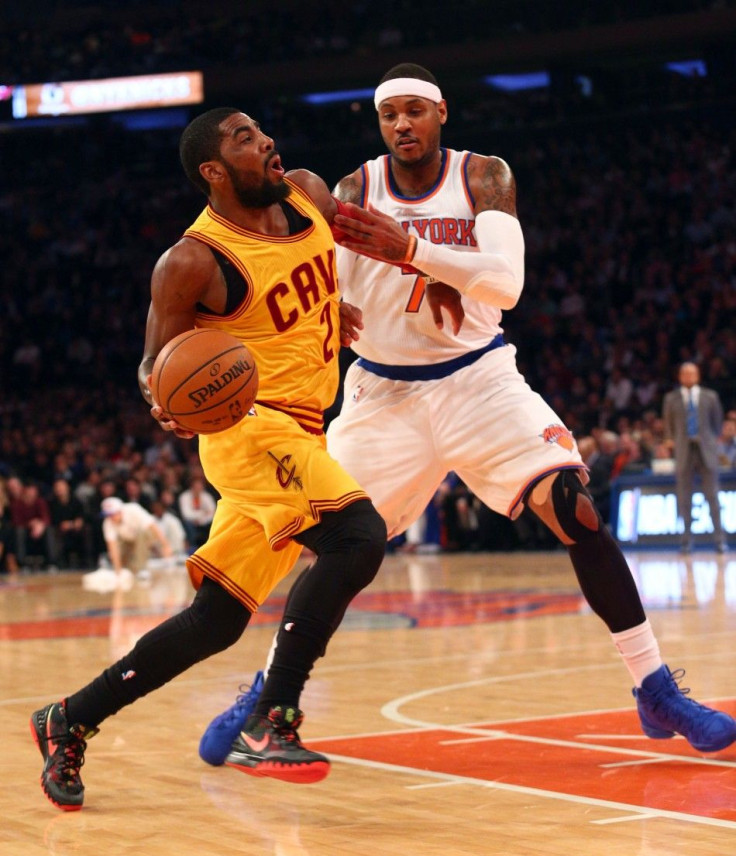 Dec 4, 2014; New York, NY, USA; Cleveland Cavaliers point guard Kyrie Irving (2) is fouled by New York Knicks small forward Carmelo Anthony (7) during the first quarter at Madison Square Garden.