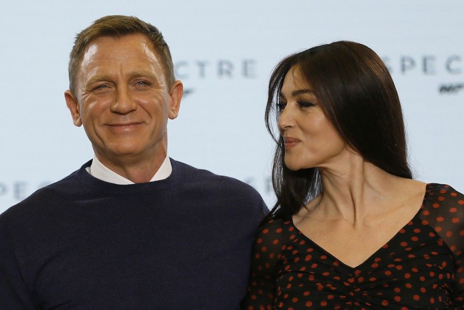 Actors Daniel Craig L and Monica Bellucci pose on stage during an event to mark the start of production for the new James Bond film quotSpectrequot