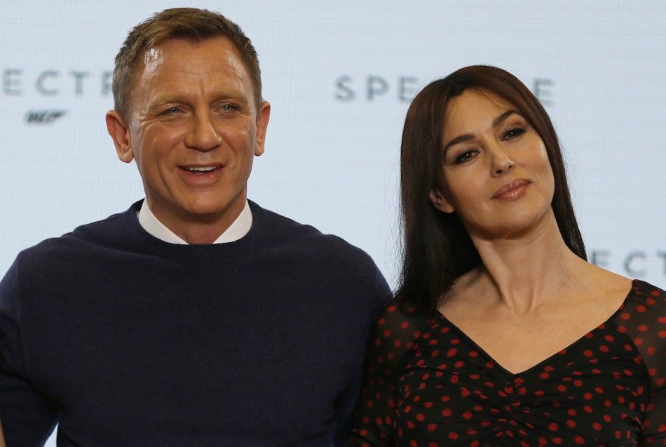 Actors Daniel Craig L and Monica Bellucci pose on stage during an event to mark the start of production for the new James Bond film quotSpectrequot