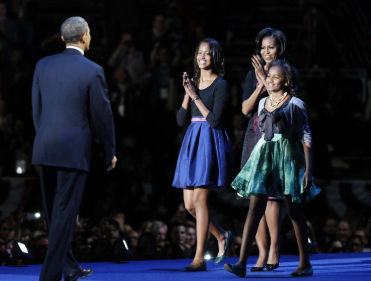 U.S. President Barack Obama is applauded by his family after his election night victory speech in Chicago