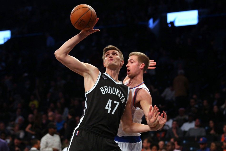 Nov 7, 2014 Brooklyn, NY, USA Brooklyn Nets small forward Andrei Kirilenko 47 grabs a rebound in front of New York Knicks small forward Travis Wear 6 during the fourth quarter at Barclays Center. The Nets defeated the Knicks 110-99.