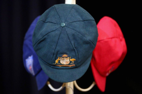 The Baggy Green and other state representative caps belonging to Australian cricketer Phillip Hughes hang near his casket