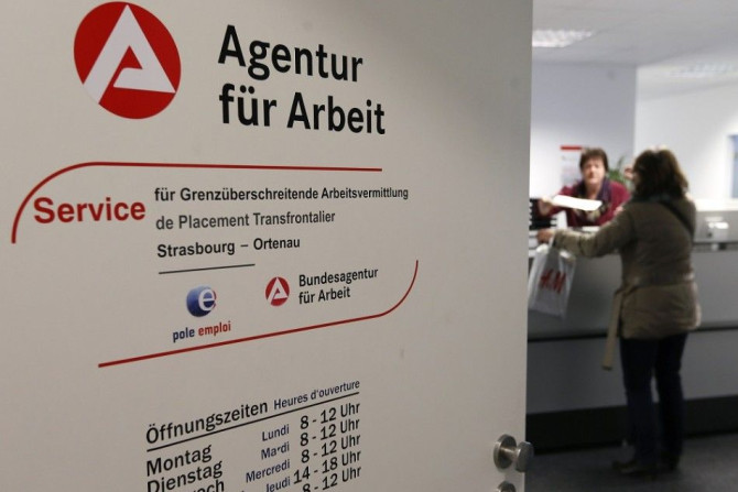 The logos of French National Agency for Employment (Pole Emploi) and it's German counterpart agency are seen on the door of the joint German-French job center office in Kehl, Germany, on the French-German border near Strasbourg, November 13, 2014. The cen