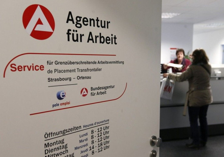 The logos of French National Agency for Employment (Pole Emploi) and it's German counterpart agency are seen on the door of the joint German-French job center office in Kehl, Germany, on the French-German border near Strasbourg, November 13, 2014. The cen