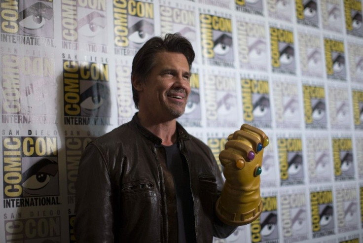 Cast member Josh Brolin wears the &quot;Infinity Gauntlet&quot; at a press line for &quot;Avengers: Age of Ultron&quot;
