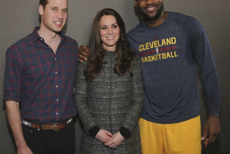 Britain's Prince William, Duke of Cambridge (L), and his wife Catherine, Duchess of Cambridge pose with LeBron James (R) backstage as they attend the Cleveland Cavaliers vs. Brooklyn Nets game at Barclays Center