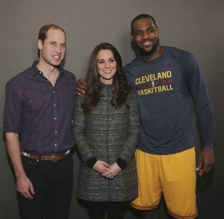 Britain's Prince William, Duke of Cambridge (L), and his wife Catherine, Duchess of Cambridge pose with LeBron James (R) backstage as they attend the Cleveland Cavaliers vs. Brooklyn Nets game at Barclays Center