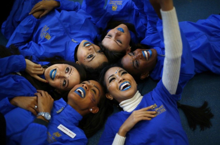 Miss Thailand Maya Nonthawan Thongleng takes a selfie with other contestants during the Miss World sports competition at the Lee Valley sports complex in north London,