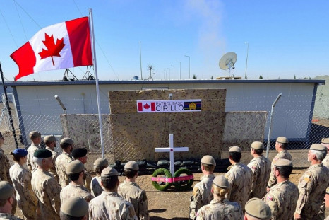 Members of the Canadian Special Operations Force Command stand at attention at the naming ceremony for the new Canadian Special Operations Force Command Patrol Base, Cirillo, in Iraq in this handout photo taken November 6, 2014, and provided by the Canadi