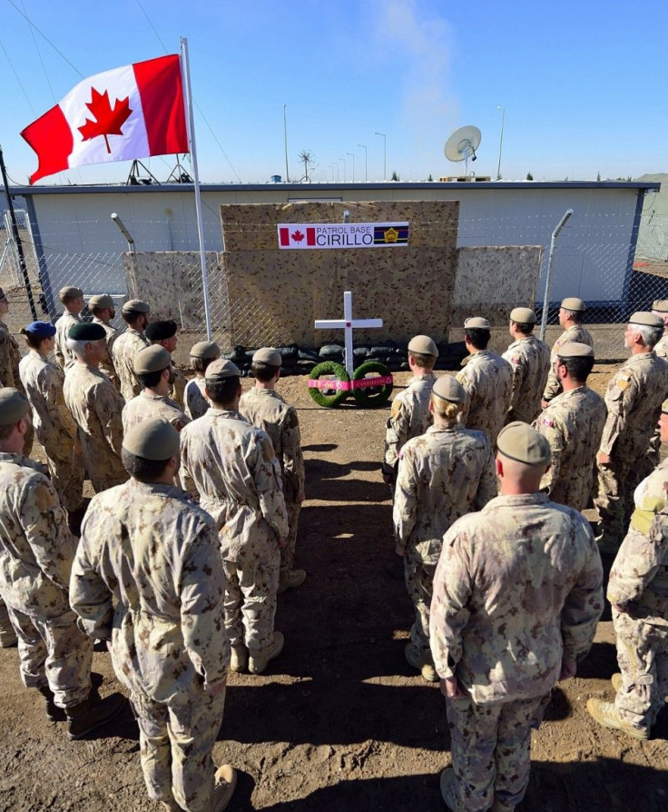 Members of the Canadian Special Operations Force Command stand at attention at the naming ceremony for the new Canadian Special Operations Force Command Patrol Base, Cirillo, in Iraq in this handout photo taken November 6, 2014, and provided by the Canadi