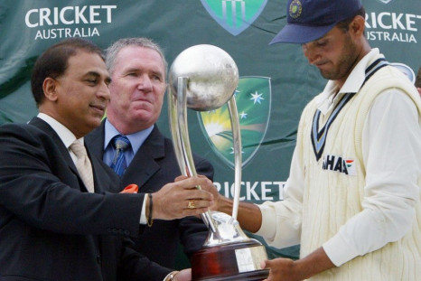 India's captain Sourav Ganguly (R) accepts the Border-Gavaskar trophy from Sanil Gavaskar (L) and Allan Border on the final day of the fourth test at the Sydney Cricket Ground January 6, 2004. The match was drawn, with India retaining the trophy after the
