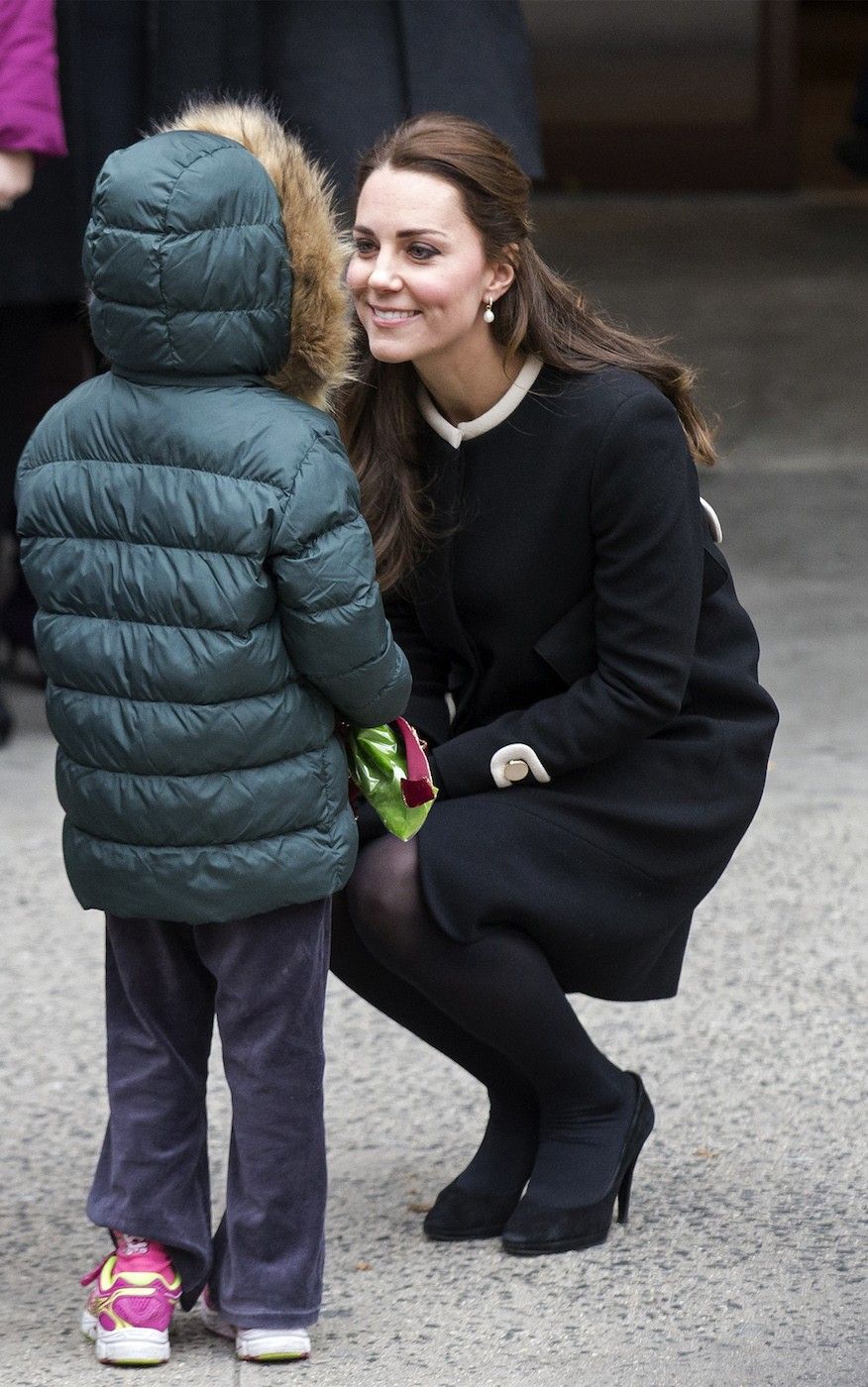Britains Catherine, Duchess of Cambridge is greeted by a child after an event at the Northside Center for Child Development in the Harlem section of New York, 