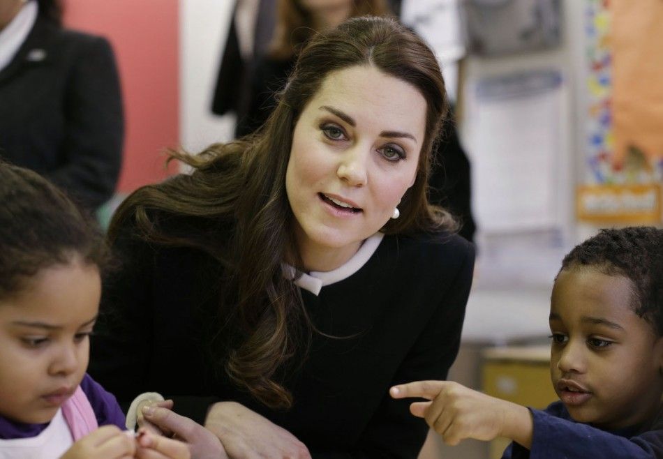 Britains Catherine, Duchess of Cambridge sits next to April, 4, L and Sammy, 4, in a pre-school class at the Northside Center for Childhood Development in New York,