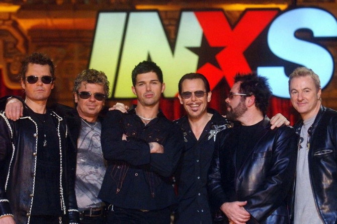 New lead singer of INXS J.D. Fortune (3rd L) poses with band members (L-R) Jon Farriss, Tim Farriss, Kirk Pengilly, Andrew Farriss and Garry Beers following the taping of the final episode of &quot;Rock Star INXS&quot; during which he was selected from th