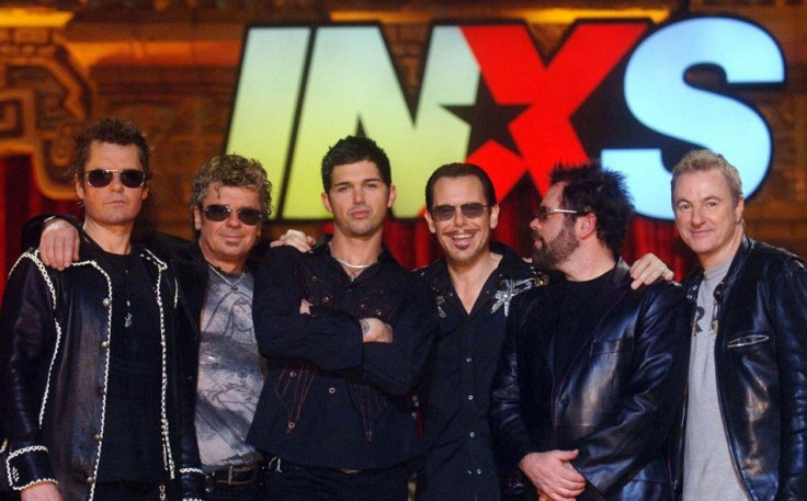 New lead singer of INXS J.D. Fortune (3rd L) poses with band members (L-R) Jon Farriss, Tim Farriss, Kirk Pengilly, Andrew Farriss and Garry Beers following the taping of the final episode of &quot;Rock Star INXS&quot; during which he was selected from th