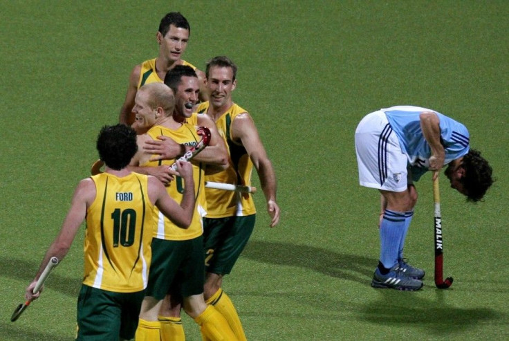 Members of the Australian hockey team celebrate a goal scored by Robert Hammond (2nd L) against Argentina during their Men&#039;s Field Hockey World Cup match at the Warsteiner Hockey Park stadium in Moenchengladbach September 9, 2006.