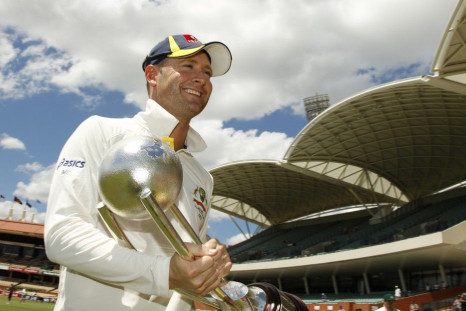 Australian captain Michael Clarke walks with the Border-Gavaskar Trophy after winning the series 4-0 against India in Adelaide January 28, 2012.