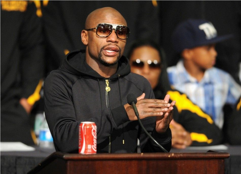 WBCWBA welterweight champion Floyd Mayweather Jr. of the U.S. talks about his hand during a post fight news conference