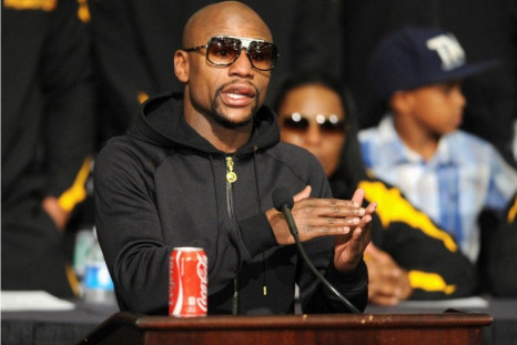 WBC/WBA welterweight champion Floyd Mayweather Jr. of the U.S. talks about his hand during a post fight news conference