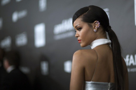 Singer Rihanna poses at the amfAR's Fifth Annual Inspiration Gala in Los Angeles, California October 29, 2014.