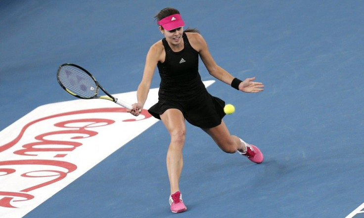 Ana Ivanovic of the Micromax Indian Aces hits a return shot to Daniela Hantuchova of the Singapore Slammers during their women's singles match at the International Premier Tennis League (IPTL) in New Delhi, December 7, 2014. REUTERS/Adnan Abidi