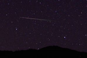 A meteor streaks over the northern skies in the early morning during the Perseid meteor shower north of Castaic Lake, California August 12, 2013. According to NASA, the Perseid meteor shower, which is an annual event, reaches its peak on August 11 and 12.