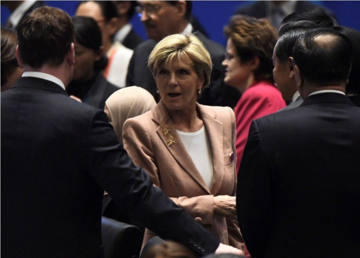 Australia's Foreign Minister Julie Bishop (C) speaks with China's Foreign Minister Wang Yi and Canada's Foreign Minister John Baird