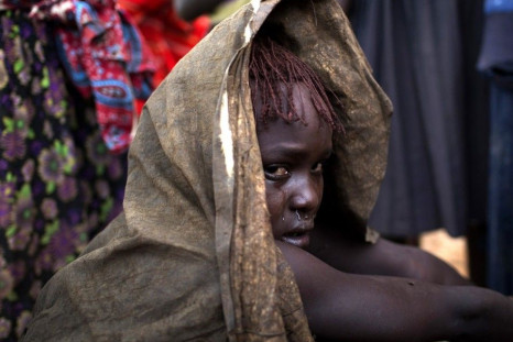 A Pokot girl cries after being circumcised in a village about 80 kilometres from the town of Marigat in Baringo County, October 16, 2014. The traditional practice of circumcision within the Pokot tribe is a rite of passage that marks the transition to wom