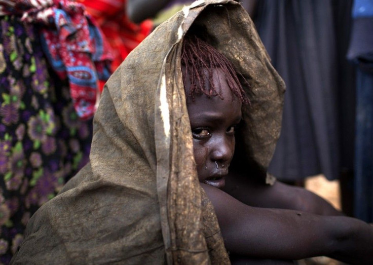 A Pokot girl cries after being circumcised in a village about 80 kilometres from the town of Marigat in Baringo County, October 16, 2014. The traditional practice of circumcision within the Pokot tribe is a rite of passage that marks the transition to wom