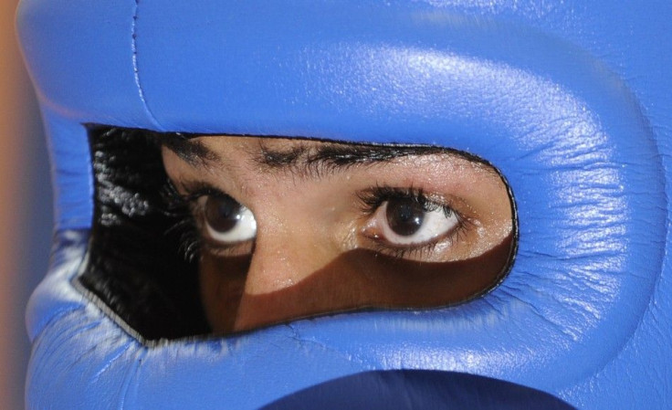 Britain&#039;s Amir Khan is seen through his headguard during a training session at a gym in Bolton