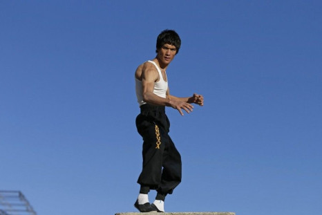 Abbas Alizada, who calls himself the Afghan Bruce Lee, poses for the media in Kabul December 9, 2014. From the ruins of an iconic bombed-out palace above Kabul, the young Afghan man bearing a striking resemblance to kung fu legend Bruce Lee is high-kickin
